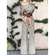 Anna | Off-shoulder jumpsuit met bloemenprint in de kleur Zilver voor dames in Party stijl ideaal voor de zomer.