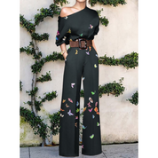 Anna | Off-shoulder jumpsuit met bloemenprint in de kleur Zwart voor dames in Party stijl ideaal voor de zomer.