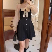 Annela | Dames lange mouw mini feestjurk in de kleur Zwart voor dames in Party stijl ideaal voor de lente.