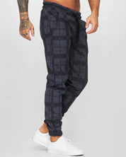 Dean | Comfortabele geruite joggingbroek in de kleur Zwart voor heren in Lounge stijl ideaal voor de herfst.