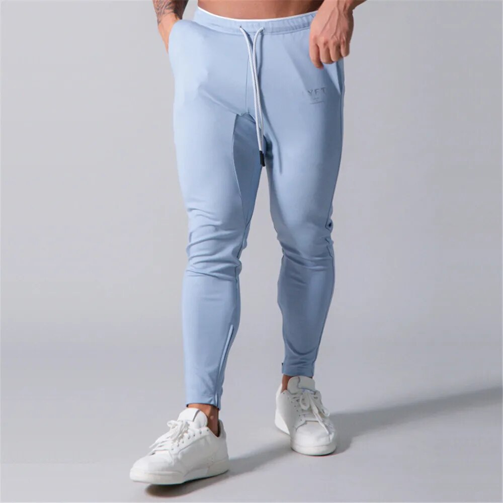 Filip | Heren Slim-Fit Joggers voor Fitnessruimte in de kleur Blauw voor heren in Lounge stijl geschikt voor alle seizoenen.