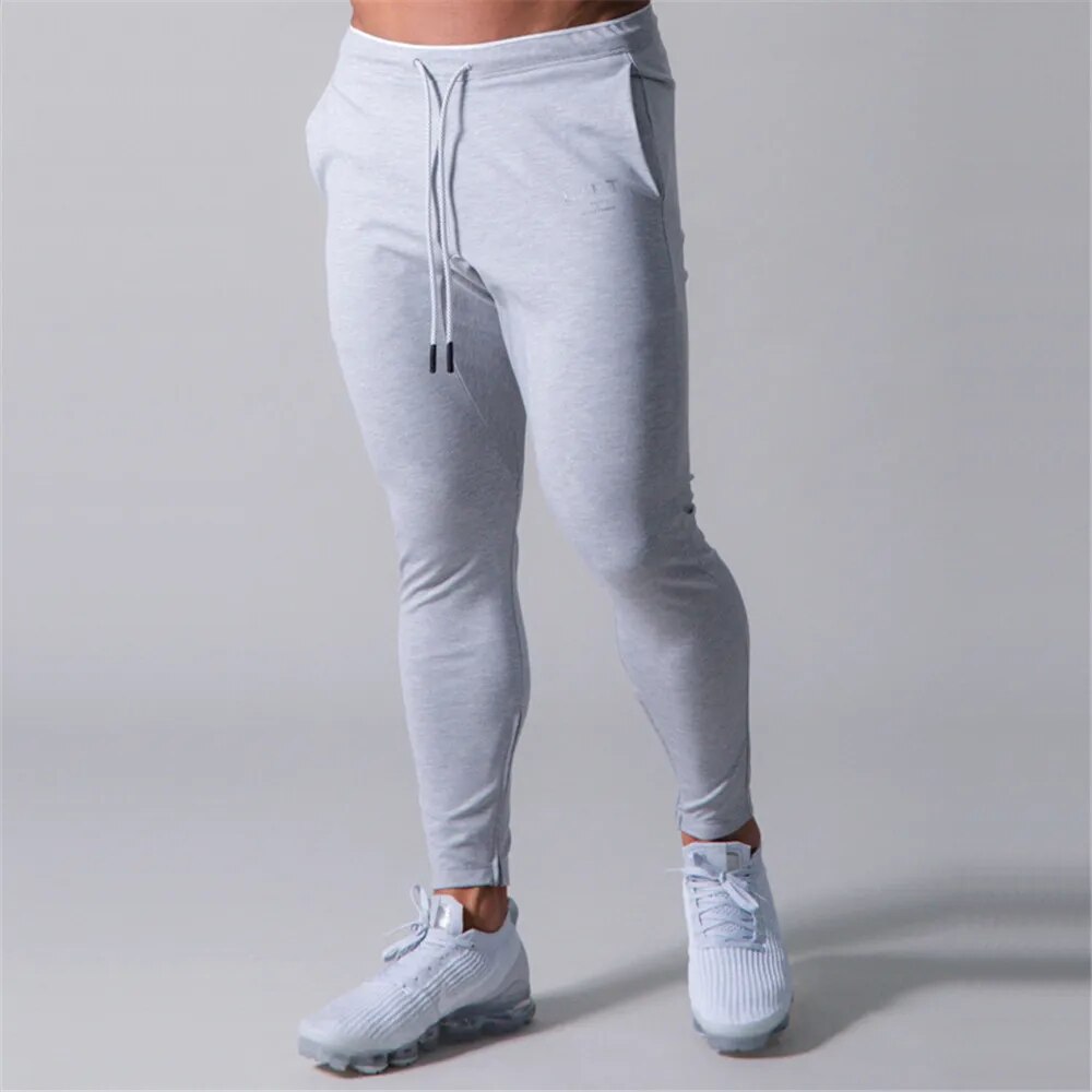 Filip | Heren Slim-Fit Joggers voor Fitnessruimte in de kleur Grijs voor heren in Lounge stijl geschikt voor alle seizoenen.