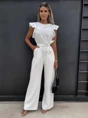 Ultieme elegantie - deze jumpsuit is een stijlvolle keuze met prachtige wijde pijpen voor een trendy uitstraling. Kenmerken zijn onder andere een ronde halslijn, lichte rekbaarheid voor comfort en een perfecte pasvorm die flatteert.