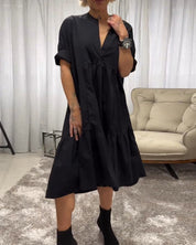 Jurk met 3/4 mouwen en diepe V-hals in de kleur Zwart voor dames in stijl ideaal voor de herfst.