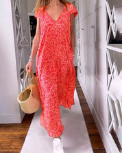 Lange jurk met korte mouwen en V-hals met print in de kleur Rood voor dames in stijl ideaal voor de herfst.