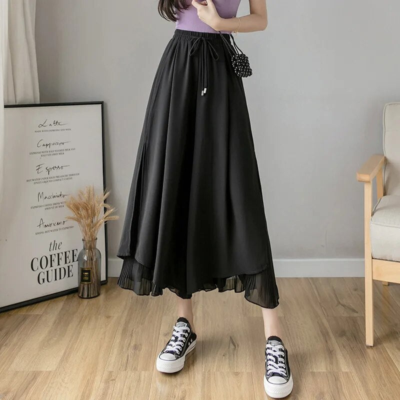 Lise | Vrouwen hoge taille chiffon rok met plooien in de kleur Zwart voor in stijl ideaal voor de lente.