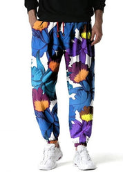 Loeka | Bloemenprint Joggingbroek met stijl in de kleur Paars voor heren in Lounge stijl ideaal voor de lente.