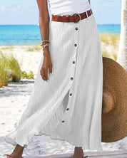 Deze elegante lange rok is geschikt voor diverse gelegenheden en biedt een comfortabele en stijlvolle look. De rok heeft een eenvoudige A-lijn silhouet, een effen kleur en een trendy maxi-lengte. Gemaakt van een katoenmix en polyester.