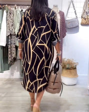 Midi Jurk met lange mouwen in de kleur Zwart voor dames in stijl ideaal voor de zomer.