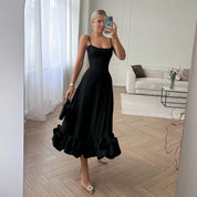 Miriam | Charmante midi-jurk met volants in de kleur Zwart voor dames in stijl ideaal voor de lente.