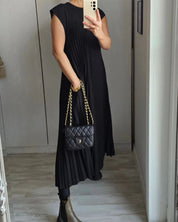 Mouwloze geplooide eenvoudige effen kleur jurk in de kleur Beige voor dames in stijl ideaal voor de herfst.