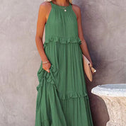 Mouwloze Jurk Maud in de kleur Groen voor dames in stijl ideaal voor de lente.