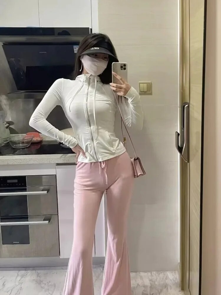 Rosa | Flared broek met hoge taille in de kleur Roze voor dames in stijl geschikt voor alle seizoenen.