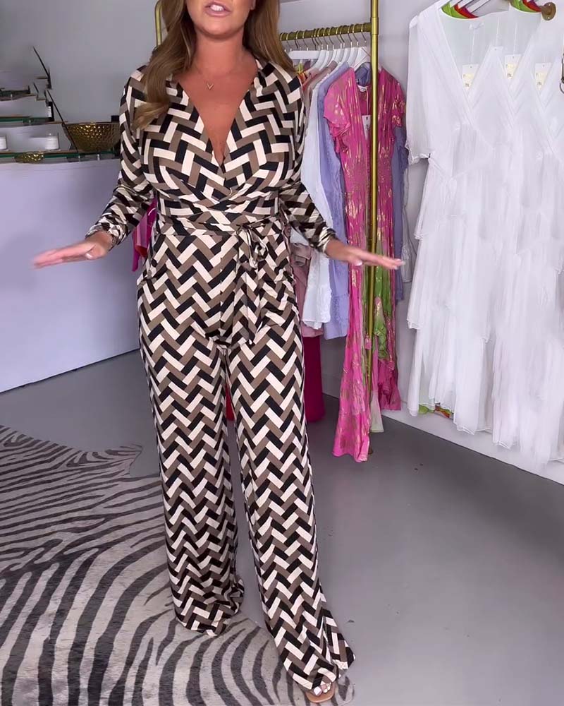 Stijlvolle bedrukte jumpsuit met lange mouwen en diepe V-hals. in de kleur Zwart voor dames in stijl ideaal voor de lente.