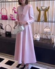 Arial | Effen kleur elegante jurk met strikken in de kleur Roze voor dames in stijl ideaal voor de herfst.