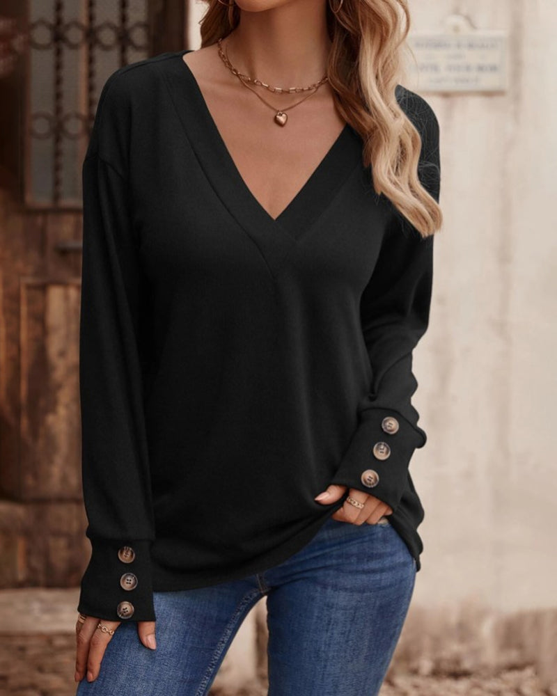Effen kleur top met v-hals, knopen en lange mouwen in de kleur Zwart voor dames in stijl ideaal voor de herfst.