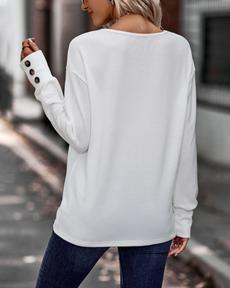 Effen kleur top met v-hals, knopen en lange mouwen in de kleur Zwart voor dames in stijl ideaal voor de herfst.