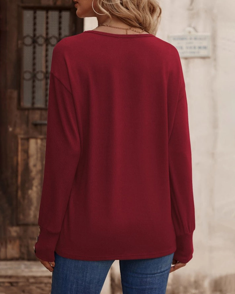 Effen kleur top met v-hals, knopen en lange mouwen in de kleur Zwart voor dames in stijl ideaal voor de herfst.