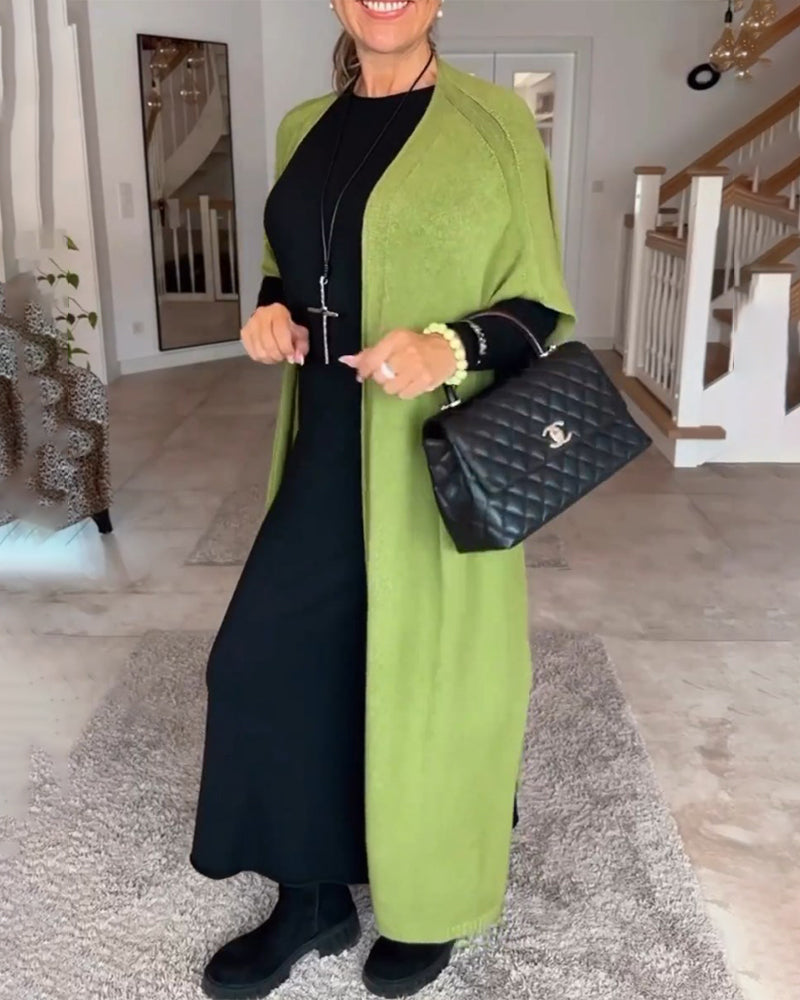 Effen lange jurk met ronde hals in de kleur Zwart voor dames in stijl ideaal voor de herfst.