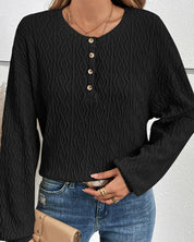 Effen topje met knopen in de kleur Zwart voor dames in stijl ideaal voor de herfst.