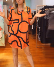 Losse jurk met 3/4 mouwen in de kleur Oranje voor dames in stijl ideaal voor de herfst.