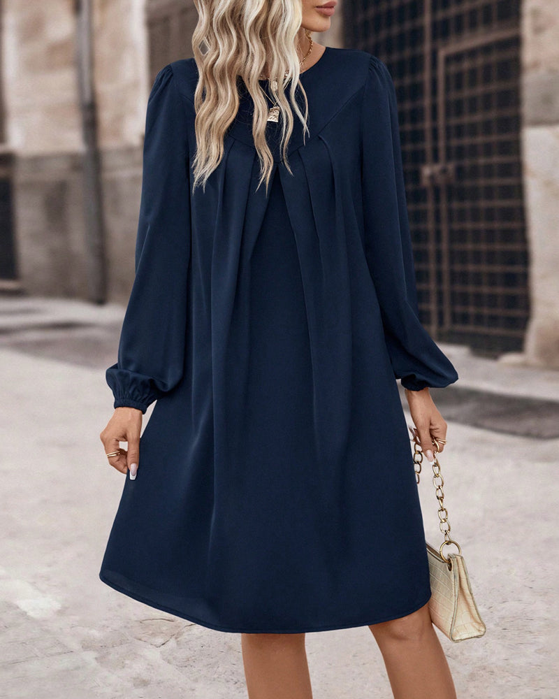 Losse jurk met lange mouwen in de kleur Marineblauw voor dames in stijl ideaal voor de herfst.