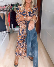 Maxi Jurk met V-hals Quincy in de kleur Oranje voor dames in stijl ideaal voor de herfst.