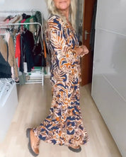 Maxi Jurk met V-hals Quincy in de kleur Oranje voor dames in stijl ideaal voor de herfst.