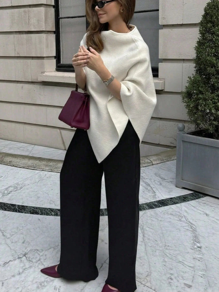 Oversized poncho met asymmetrische hals