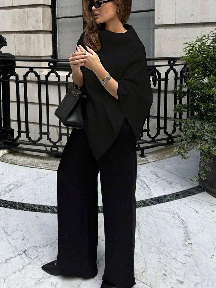 Oversized poncho met asymmetrische hals