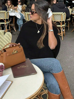 Oversized poncho met asymmetrische hals