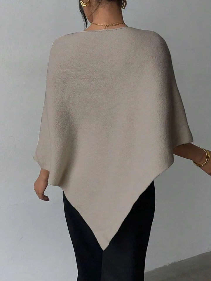 Oversized poncho met asymmetrische hals