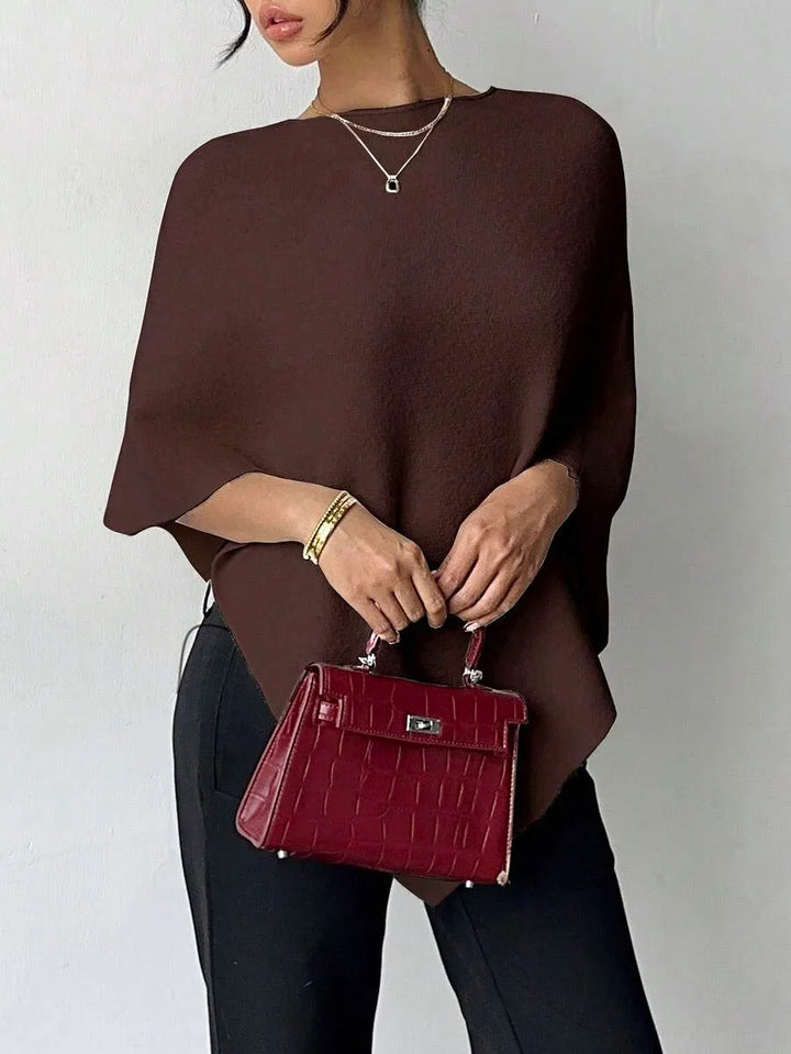 Oversized poncho met asymmetrische hals