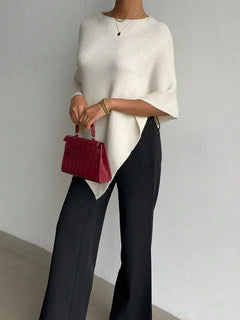 Oversized poncho met asymmetrische hals