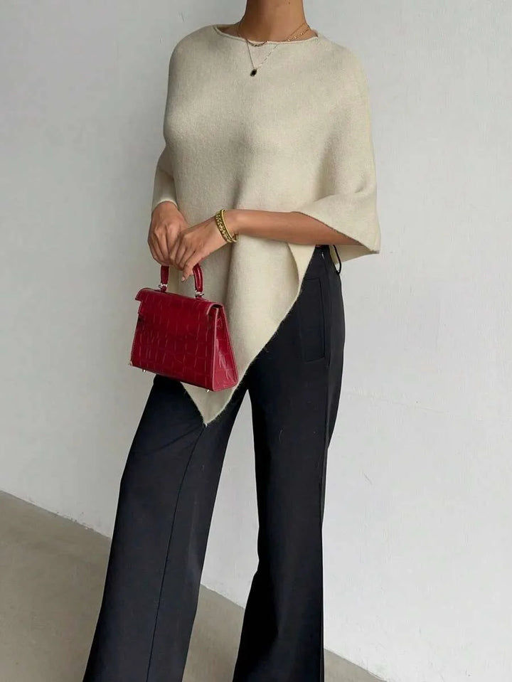 Oversized poncho met asymmetrische hals