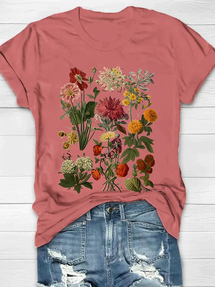 Vintage T-shirt met bloemenprint, perfecte combinatie van comfort en trendy stijl. Ideaal voor diverse gelegenheden en ontworpen voor bewegingsvrijheid.