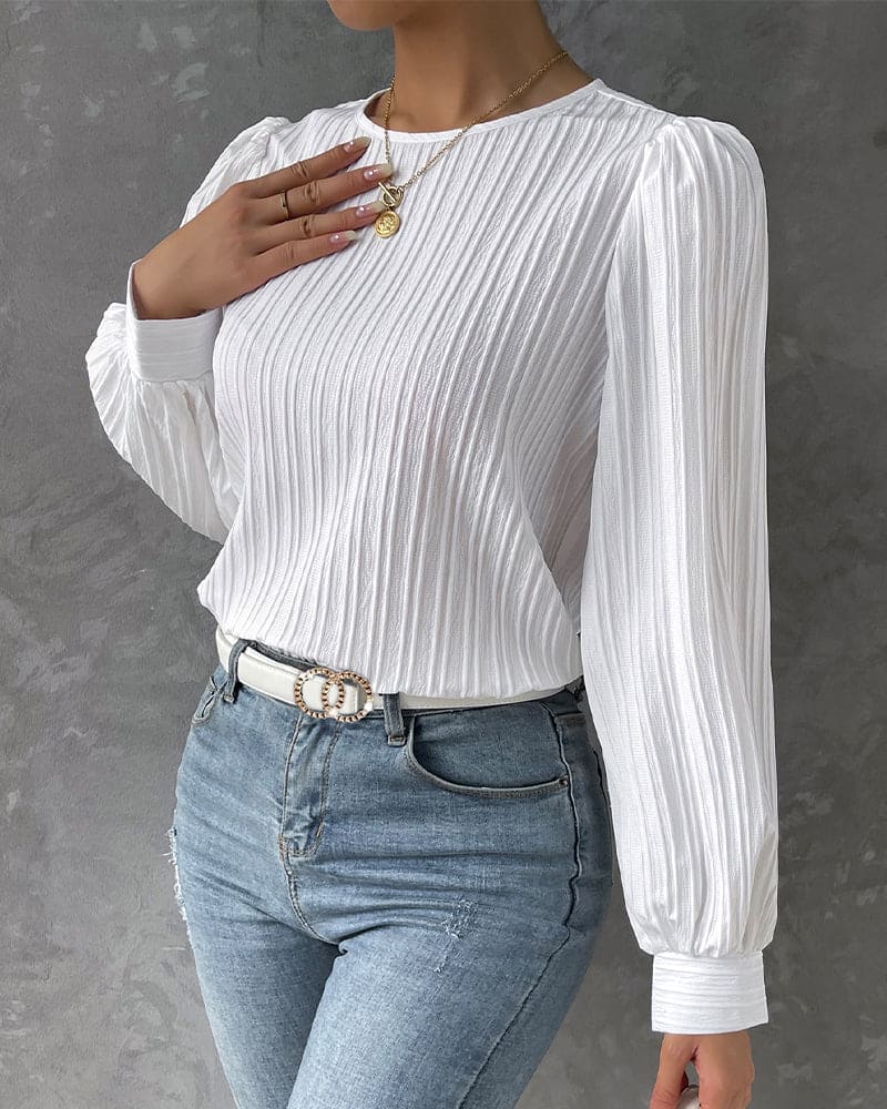 Deze stijlvolle blouse is voorzien van lantaarnmouwen voor een trendy uitstraling. Gemaakt van een katoenmix, spandex en polyester, is deze blouse geschikt voor diverse gelegenheden en biedt het een comfortabele pasvorm.