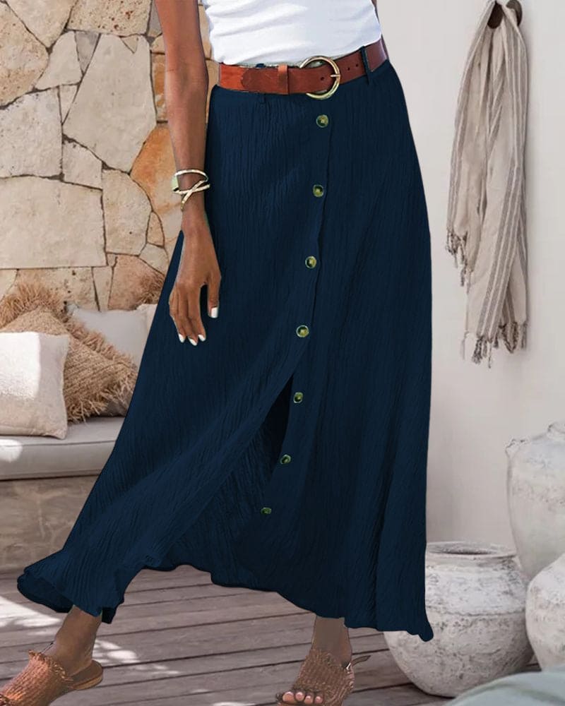 Deze elegante lange rok is geschikt voor diverse gelegenheden en biedt een comfortabele en stijlvolle look. De rok heeft een eenvoudige A-lijn silhouet, een effen kleur en een trendy maxi-lengte. Gemaakt van een katoenmix en polyester.