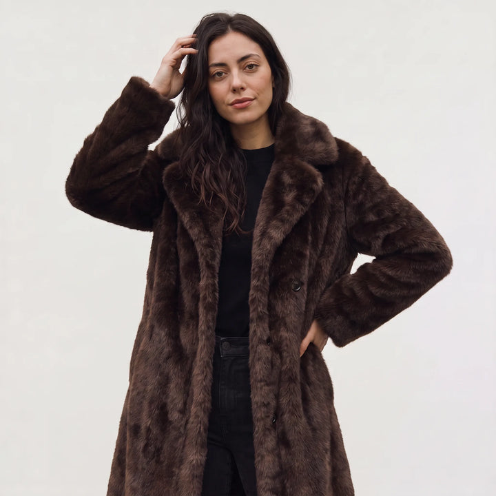 Lange faux fur jas met zakken