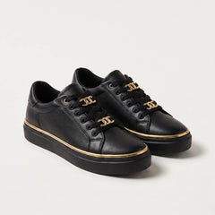 Zwarte trainers met gouden details