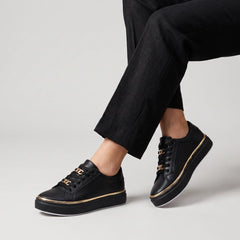 Zwarte trainers met gouden details