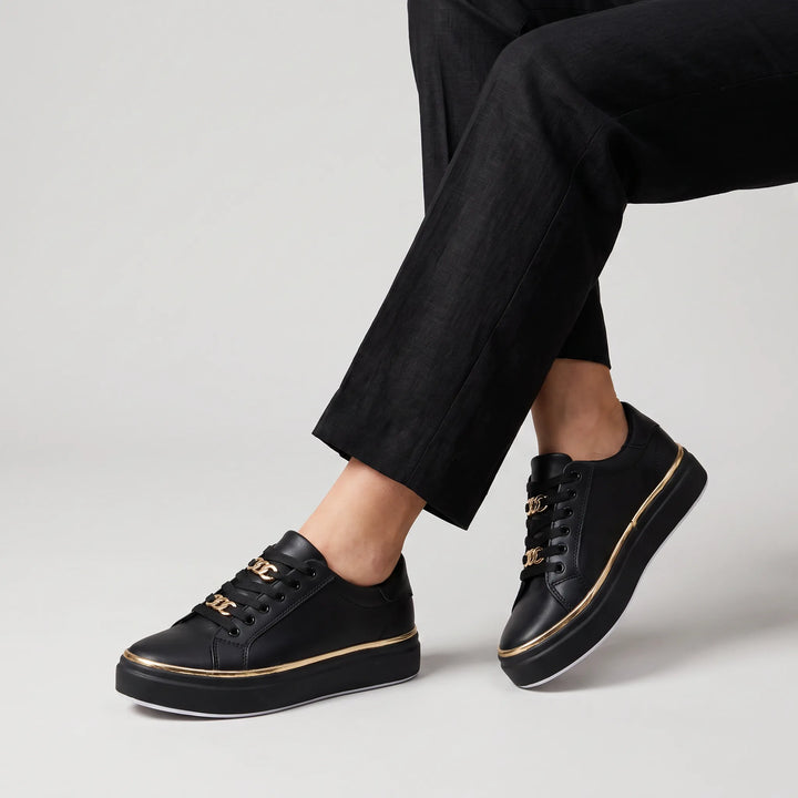 Zwarte trainers met gouden details