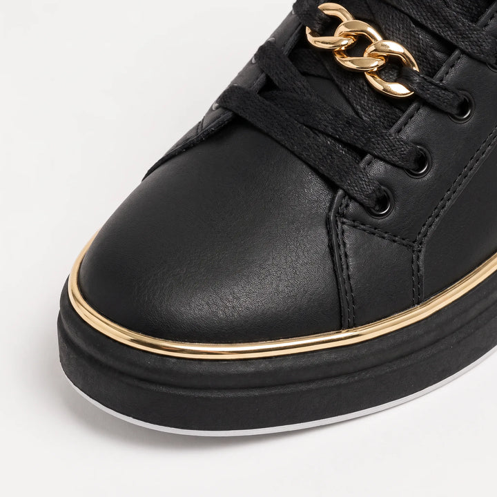 Zwarte trainers met gouden details