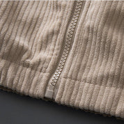 Jas van ribstof met ritssluiting en opstaande kraag