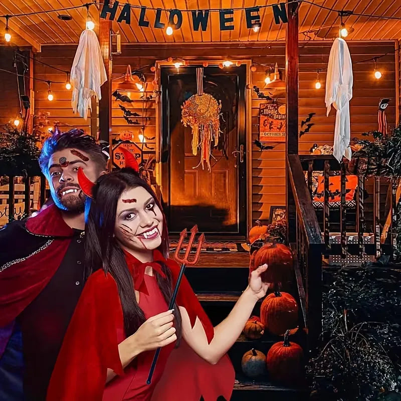 Kostuumset met rode cape en hoorn hoofdband