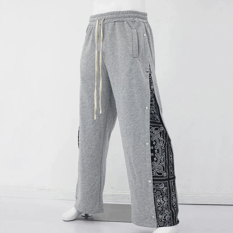 Lente-Nieuwe-Mode-Grafische-Print-Patchwork-Broek-Heren-Casual-Trekkoord-Losse-Broek-Voor-Heren-Streetwear-Trendy_ae76c67c-dad3-469f-8e5b-9147ad5e3b79.webp