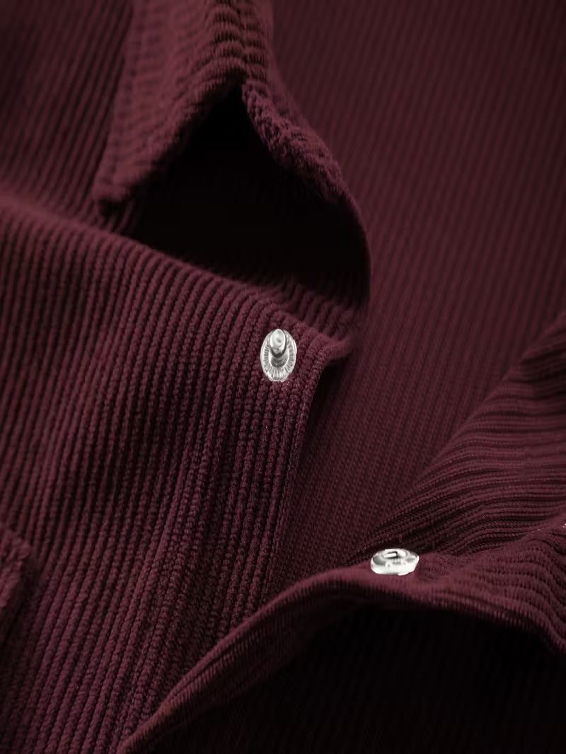 Ribfluweel jas met dubbele rij knopen