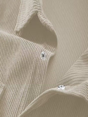 Ribfluweel jas met dubbele rij knopen