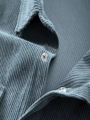 Ribfluweel jas met dubbele rij knopen