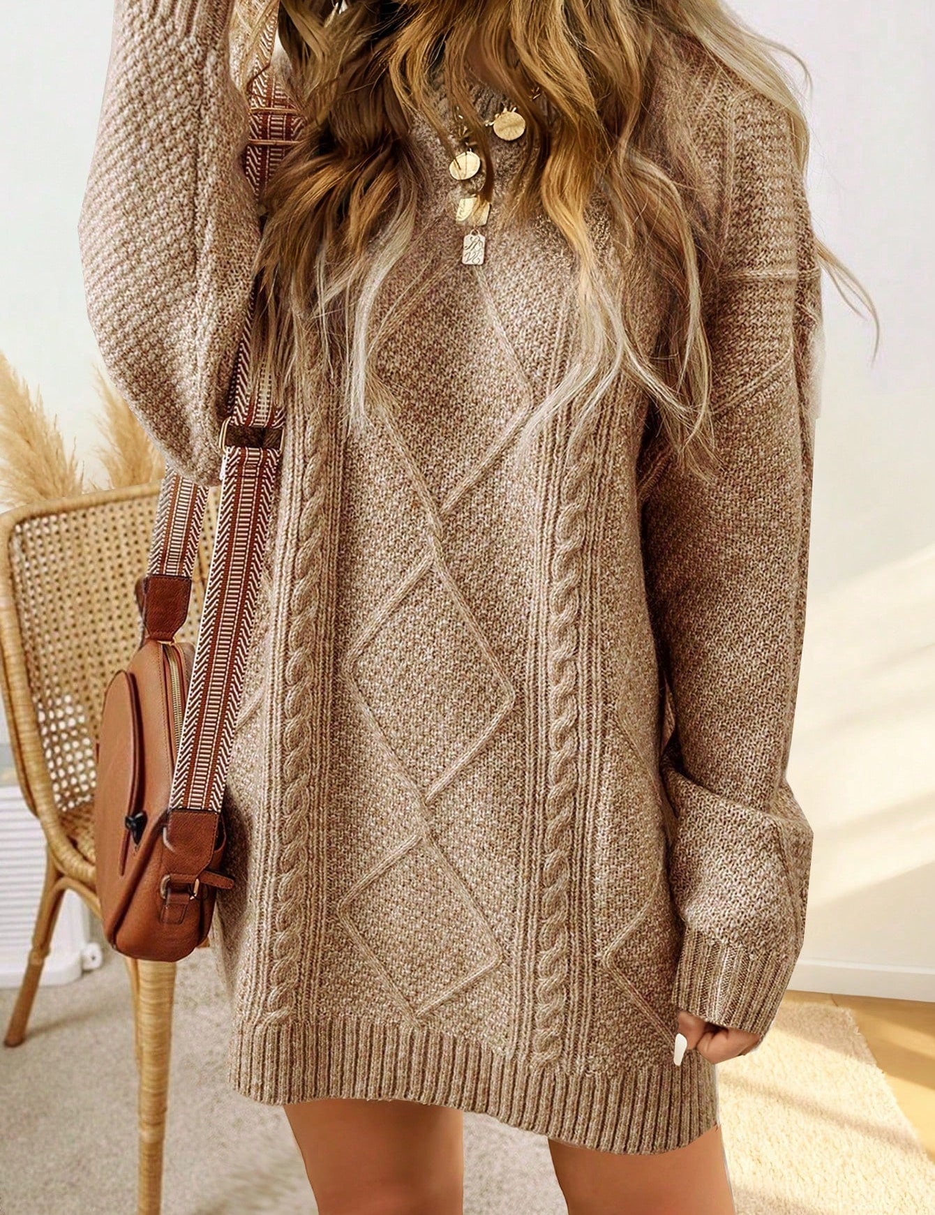 Trui jurk met kabelpatroon en ribbelafwerking